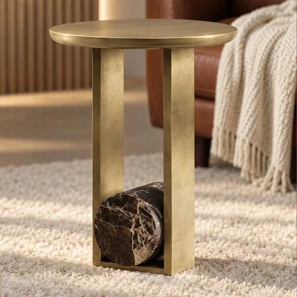 Bold elegance meets timeless materials, brass and marble, united in a sculptural side table.