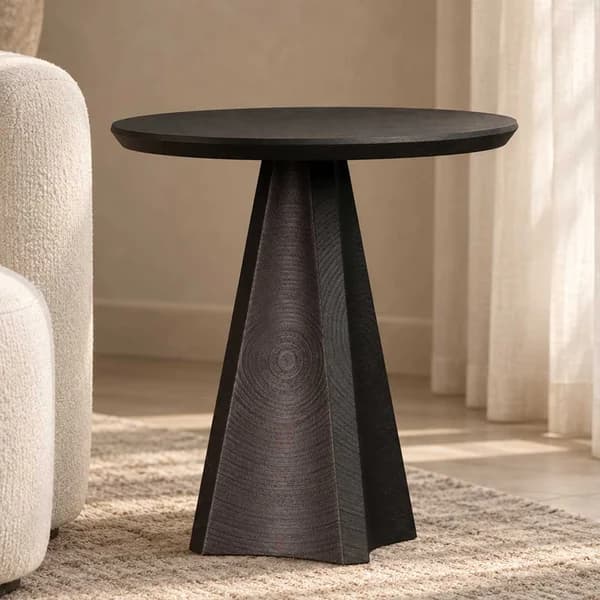 Black oak side table with sculptural shape and smooth matte finish part of the elegant Lenora set, featuring a matching coffee table and side table for cohesive modern interiors.
