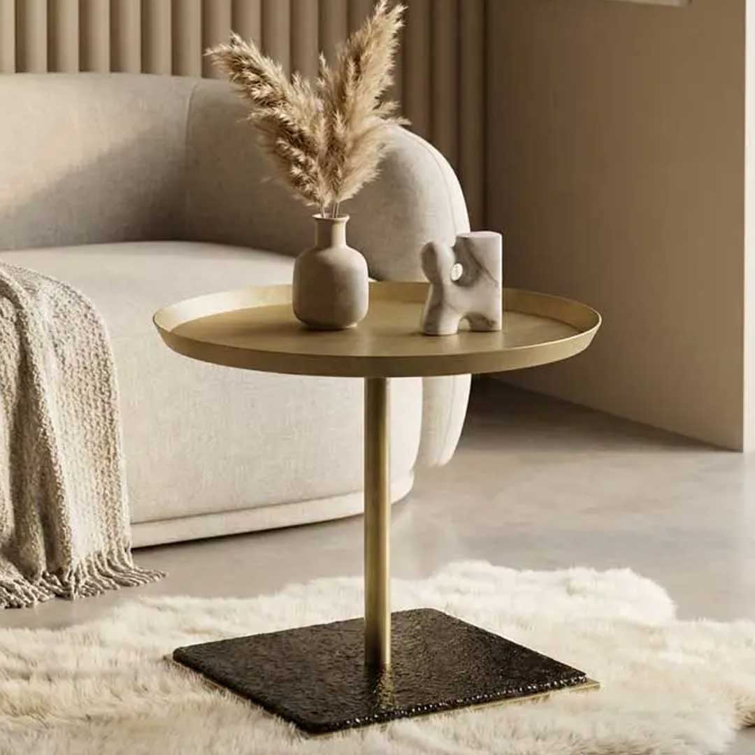 A sleek side table crafted from brass-finish metal and frosted glass.