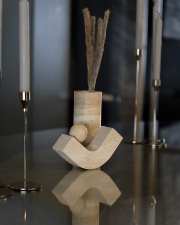 Sculpture in luxury beige travertine – a modern decorative stone accessory with a curved base and sphere, perfect for UAE designer interiors.