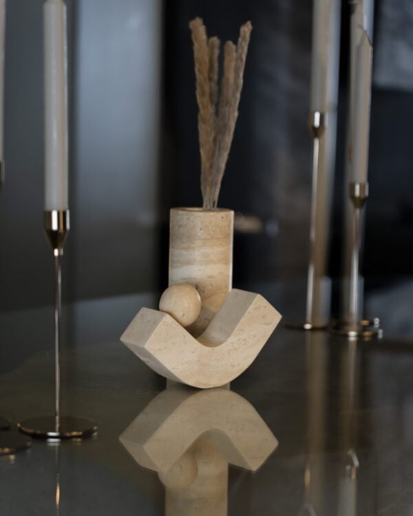 Sculpture in luxury beige travertine – a modern decorative stone accessory with a curved base and sphere, perfect for UAE designer interiors.