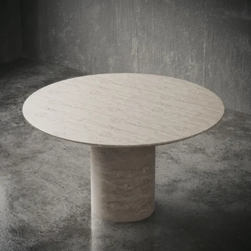 Top view of beige travertine round dining table with minimal tableware – handcrafted natural stone furniture ideal for elegant dining in the UAE "منظر علوي لطاولة طعام دائرية من ترافرتين بيج مزودة بأدوات طعام بسيطة – أثاث من الحجر الطبيعي المصنوع يدويًا مثالي لمناسبات الطعام الراقية في الإمارات"