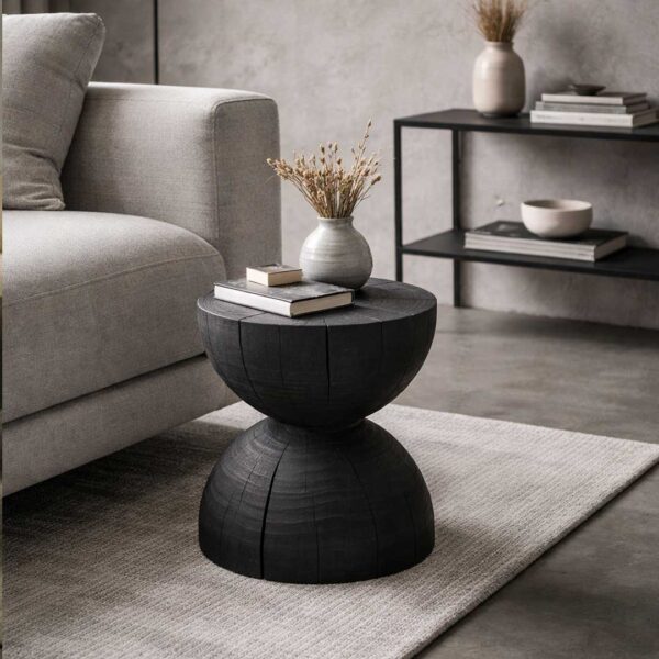COFFEE-Black sculptural wooden side table with textured finish, designed for luxury interiors in the UAE. طاولة جانبية منحوتة باللون الأسود بلمسة خشبية فاخرة، مثالية للمساحات الداخلية الراقية في الإمارات.