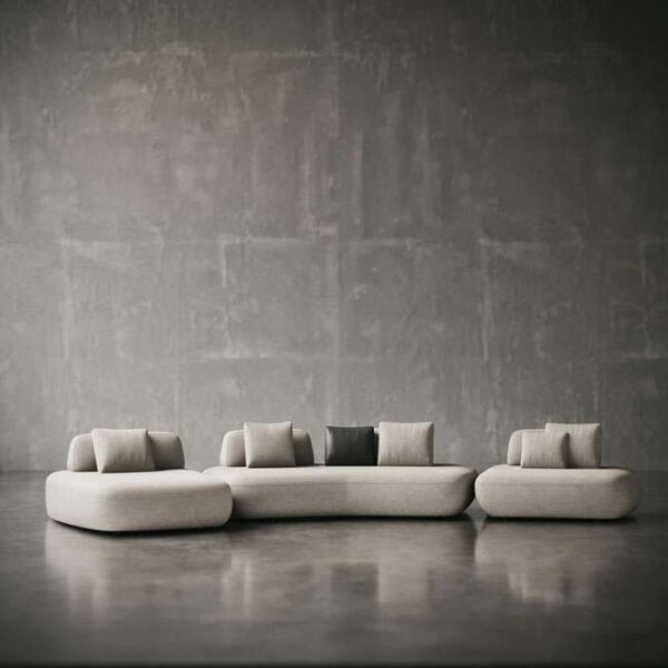 traight-on view of Sereno Slate Sofa with soft curves and modern neutral palette. منظر أمامي مباشر لكنبة سيرينو سلايت بخطوط ناعمة ولوحة ألوان حيادية عصرية.