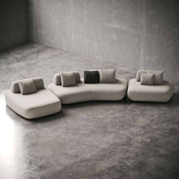 Top view of Sereno Slate Sofa layout on polished flooring, highlighting organic modular shapes. : منظر علوي لتكوين كنبة سيرينو سلايت على أرضية مصقولة، تُبرز الأشكال العضوية المكونة من وحدات.