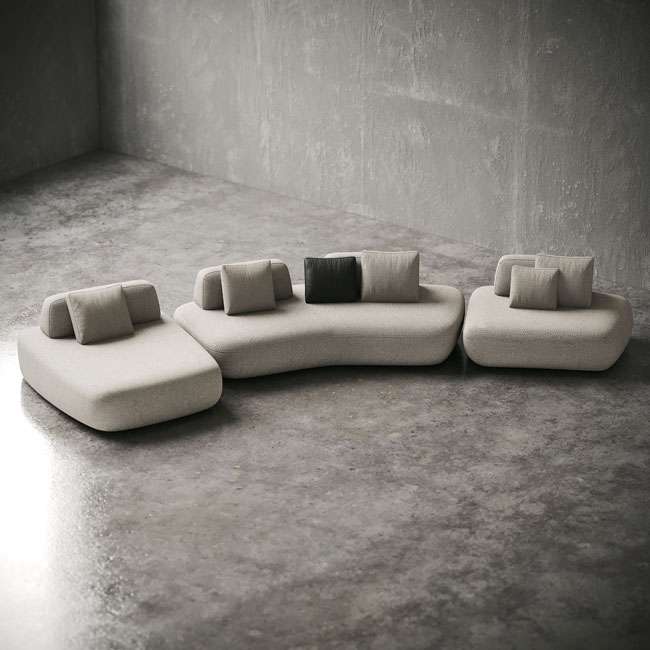 Top view of Sereno Slate Sofa layout on polished flooring, highlighting organic modular shapes. : منظر علوي لتكوين كنبة سيرينو سلايت على أرضية مصقولة، تُبرز الأشكال العضوية المكونة من وحدات.