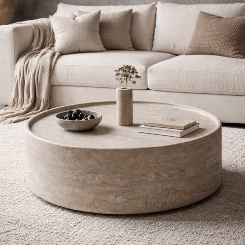 "Frontal view of Solstice round travertine coffee table – minimalist design in warm beige natural stone, perfect for contemporary interiors in the UAE" "عرض أمامي لطاولة القهوة سولستيس الدائرية من الترافرتين – تصميم بسيط من الحجر الطبيعي البيج الدافئ، مثالي للديكورات العصرية في الإمارات"