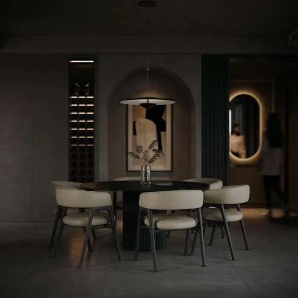 Round luxury dining table paired with high-end upholstered dining chairs in a contemporary interior by Conceptual. Designed with refined curves, premium materials, and modern architectural style, this elegant dining set is perfect for interior designers and developers sourcing luxury dining chairs in Dubai and Abu Dhabi, UAE.