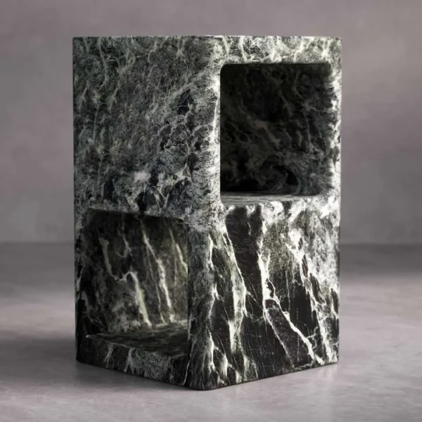 Verdura Side Table carved from solid green marble, featuring a geometric cuboid form with open shelves on both sides. The natural marble veins in shades of deep green, black, and white create a bold, luxurious statement.