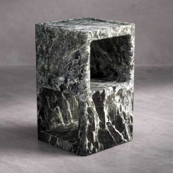 Angled view of the Verdura Side Table crafted from solid green marble. The dual open compartments and flowing stone texture highlight its balance of geometry and organic beauty.