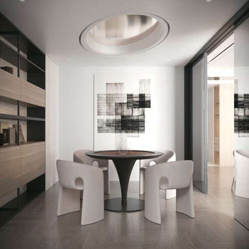 Modern dining setup with Aether Pearl beige chairs and round table in a luxury UAE home تشكيلة طعام عصرية مع كراسي أيثر بيرل بلون بيج وطاولة دائرية في منزل فاخر في الإمارات