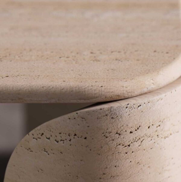 Close-up detail of the Terrene Coffee Table’s travertine surface, highlighting the natural pores, soft texture, and smooth curvature of the stone. The craftsmanship emphasizes organic form and material authenticity.