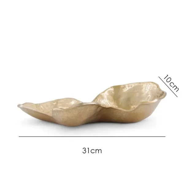 Sculptural centrepiece plate with organic curves and a radiant golden finish. UAE