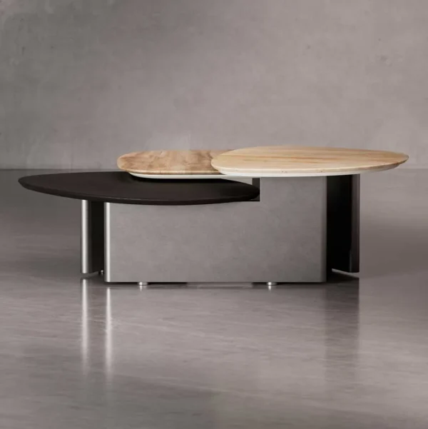 Side view of the Trivaro Coffee Table highlighting its sculptural travertine tops and sleek metal structure, crafted for luxury interiors in the UAE.