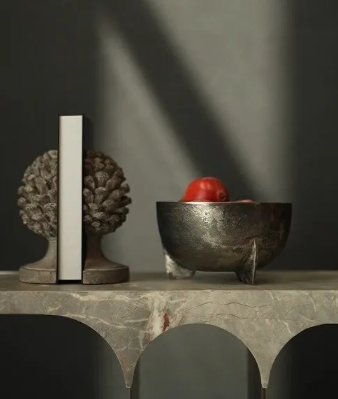 Ravon Decorative Bowl, crafted from cast aluminum with a four-leg base and a weathered silver patina. A modern luxury piece for UAE interiors وعاء راڤون الديكوري المصنوع من الألمنيوم المصبوب بقاعدة رباعية ولمسة فضية معتقة – قطعة فاخرة مثالية للمساحات العصرية في الإمارات