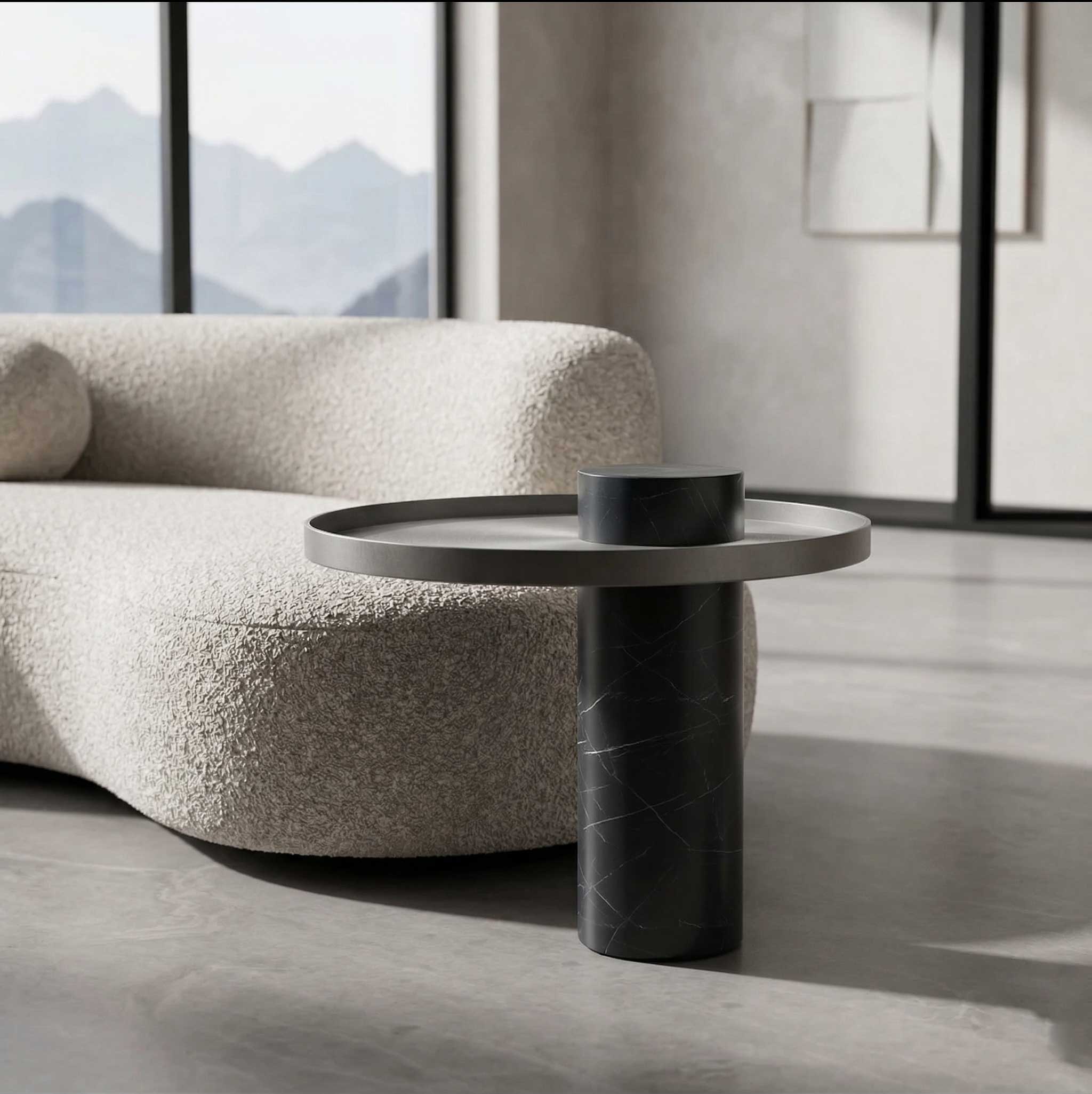 Luxury Bravura Luno Side Table crafted with a black marble cylindrical base and brushed metal top, showcasing elegant modern furniture design available in Dubai and Abu Dhabi, UAE.