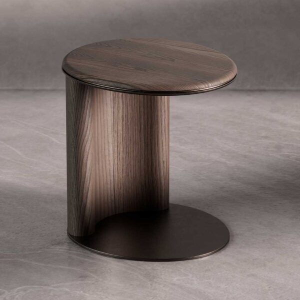 CaffeLinea Side Table featuring a minimalist cylindrical design with a curved wooden panel and circular tabletop. The smooth grain of the dark wood contrasts elegantly with the matte metal base, creating a refined, modern look.