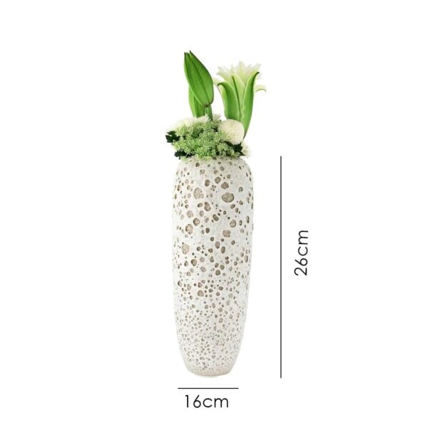Petite porcelain vase with cobweb texture – organic form, refined beauty.