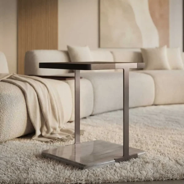 Luxury designer side table paired with a contemporary upholstered sofa in a modern living room, showcasing premium furniture design in Dubai and Abu Dhabi.