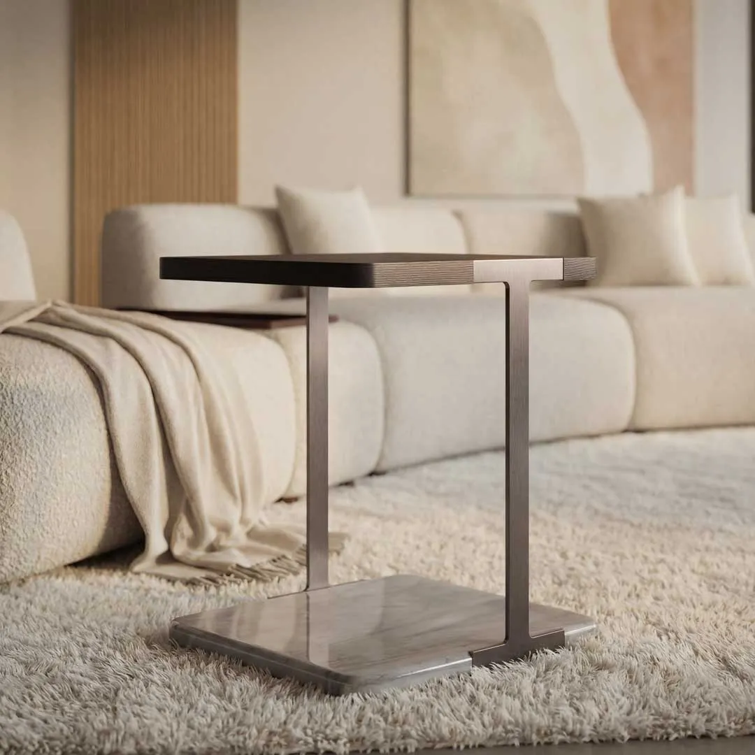 Luxury designer side table paired with a contemporary upholstered sofa in a modern living room, showcasing premium furniture design in Dubai and Abu Dhabi.