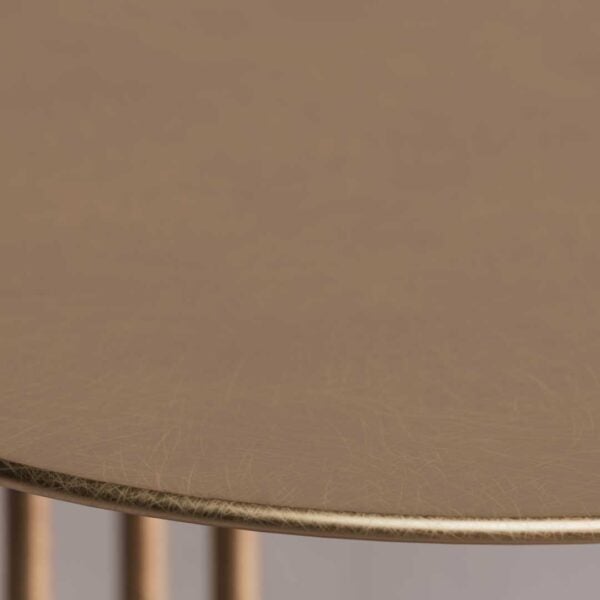 Detailed texture of the golden tabletop – premium finish for modern luxury furniture.