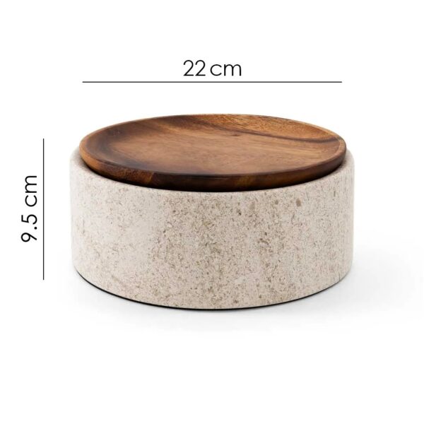round plate crafted from beige marble and warm wood. UAE