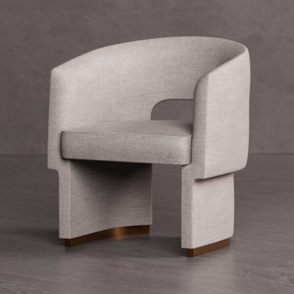 Althea Dining Chair — a contemporary upholstered chair featuring a sculptural curved backrest and textured beige fabric with brushed brass base accents, designed for elegant dining interiors in Dubai and Abu Dhabi.