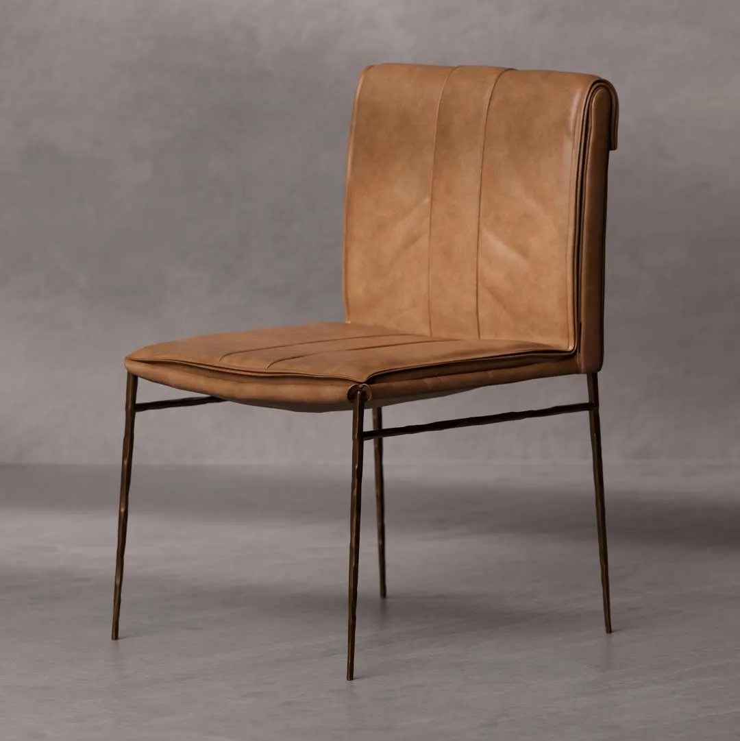 Bon Appétit Dining Chair — a refined leather dining chair featuring a stitched tan leather seat and backrest with slim bronze-finished metal legs, blending modern elegance and comfort for luxury dining spaces in Dubai and Abu Dhabi.