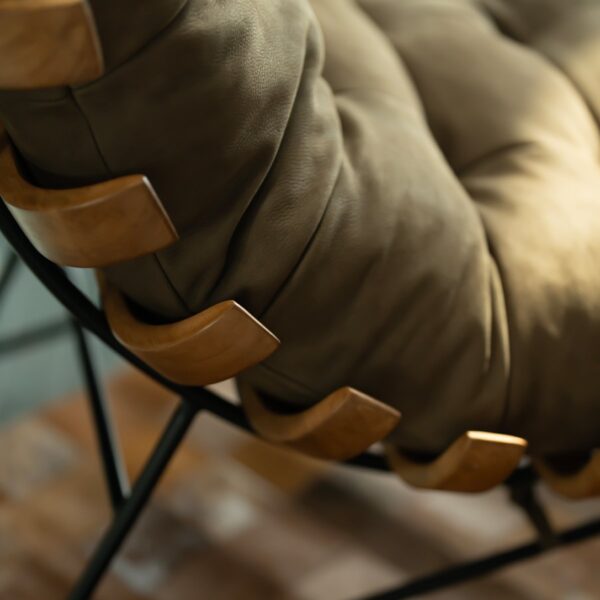 Close-up side detail of the Chancellor Lounge Chair showing its sculpted wooden supports and soft beige suede upholstery — a perfect balance of craftsmanship, comfort, and modern luxury for interiors in Dubai and Abu Dhabi.