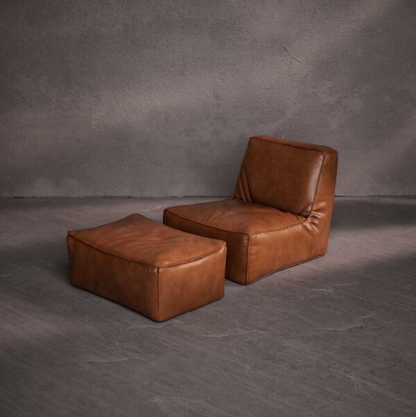 Molaro Lounge Chair in premium brown leather – modern low-profile design with plush comfort for luxury living in the UAE. كرسي مولوارو لاونج من الجلد البني الفاخر – تصميم عصري منخفض مع راحة فاخرة للمساحات الراقية في الإمارات