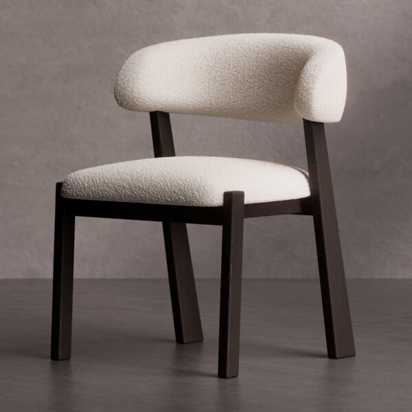 Nest Form Dining Chair — a modern designer chair featuring soft white boucle upholstery and a sleek dark wood frame, crafted for elegant dining interiors in Dubai and Abu Dhabi.
