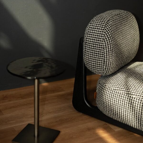 Close-up view of the Selden Lounge Chair’s wooden base and cushion connection, showcasing precision craftsmanship and modern detailing.