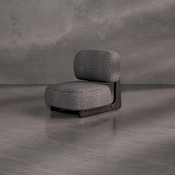 Selden Lounge Chair — a luxury contemporary lounge chair featuring a low-profile design with rounded cushions in textured fabric and a sleek dark wooden frame, ideal for sophisticated interiors in Dubai and Abu Dhabi.