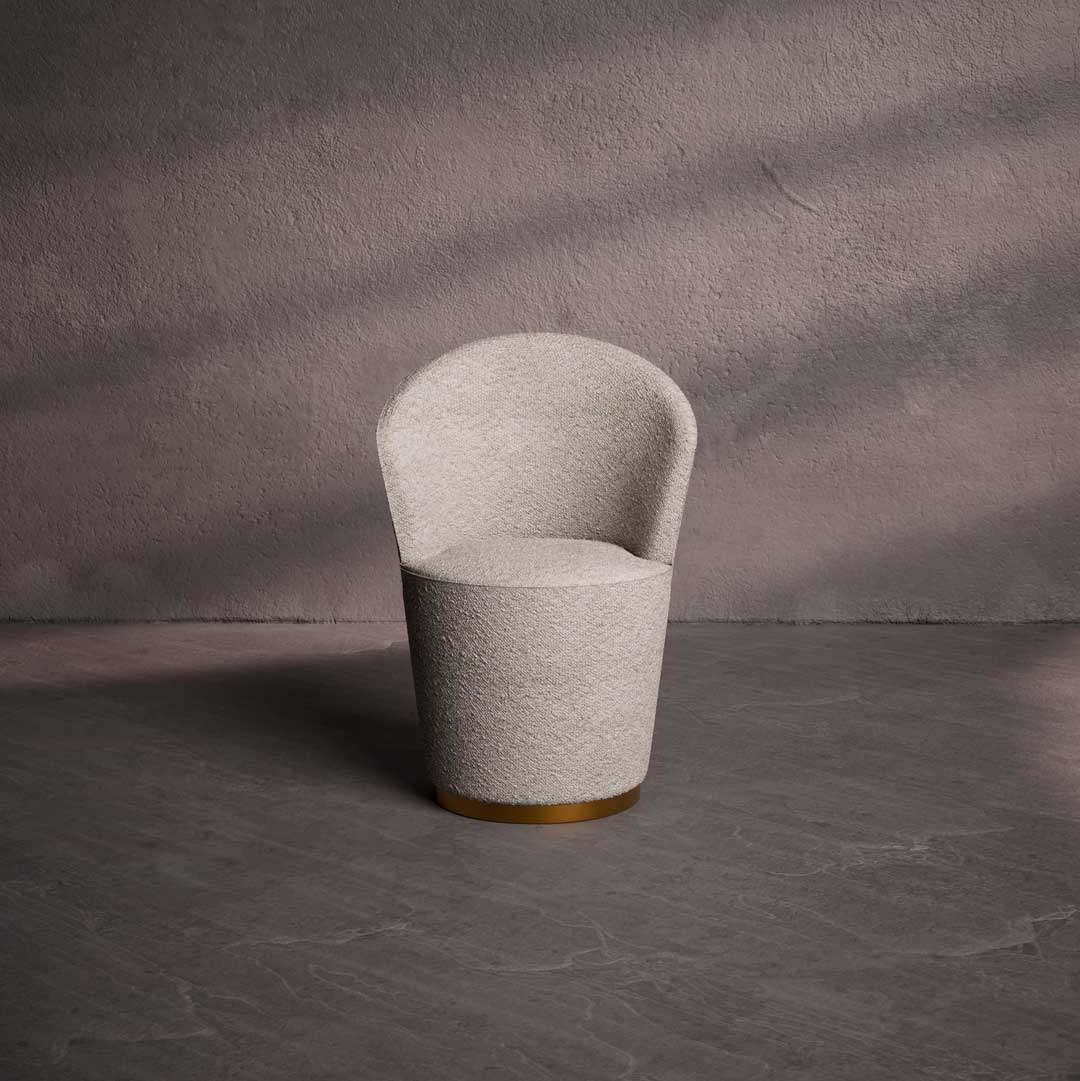 "Front view of Selvara luxury dining chair in textured cream fabric with a gold base – elegant and modern UAE dining furniture." "المنظر الأمامي لكرسي طعام سيلفارا الفاخر بقماش كريمي ملمس وقاعدة ذهبية – أثاث طعام أنيق وعصري في الإمارات." "Selvara luxury dining chair in textured cream fabric with a gold accent ring and base, shown from the back – elegant modern furniture for UAE interiors."