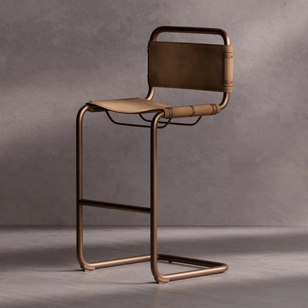Senaro Bar Chair — a sleek contemporary bar chair with a minimalist bronze metal frame and tan leather seat and backrest, crafted for luxury modern interiors in Dubai and Abu Dhabi..