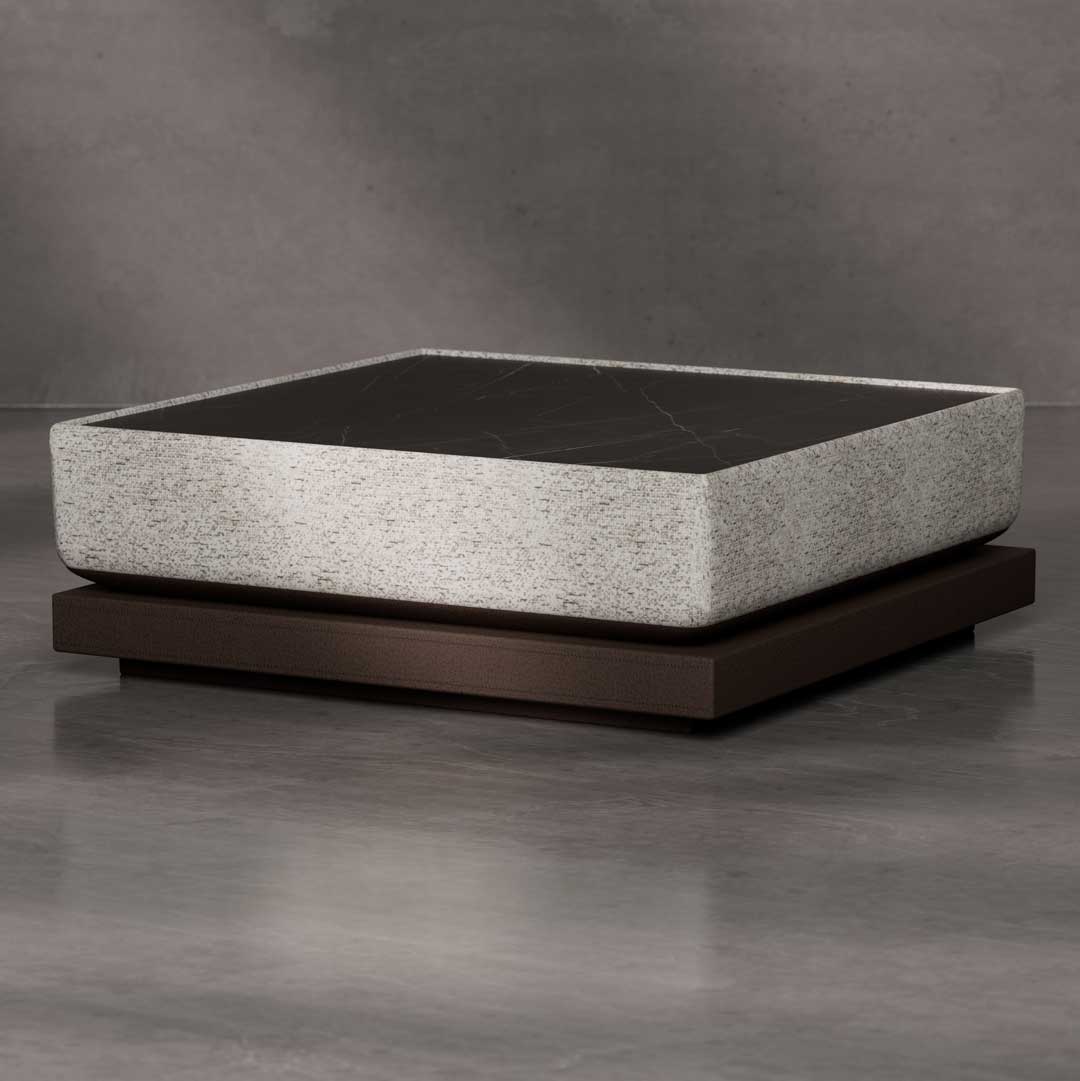 Luxury modern square coffee table featuring a sleek black marble top with a textured stone frame, set on a dark wooden base an elegant designer piece for high-end interiors in Dubai and Abu Dhabi