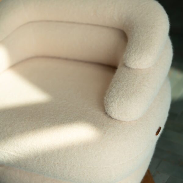 Angled view of Creamy Lounge Chair showcasing plush textured upholstery and organic curves – premium designer furniture in UAE