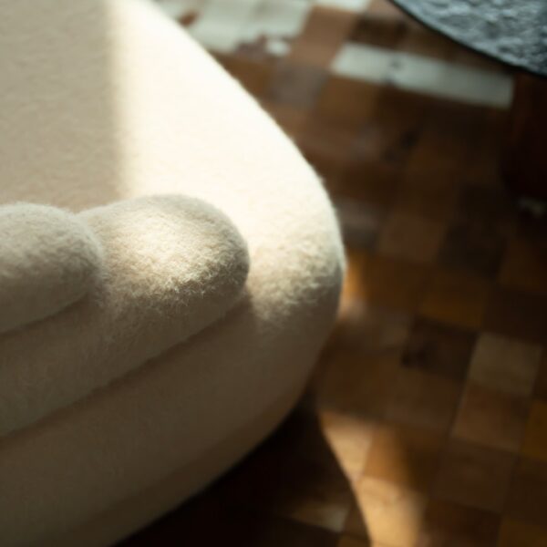Detail shot of Creamy Lounge Chair base and sculptural form, highlighting artisanal craftsmanship for luxury homes in Dubai and Abu Dhabi