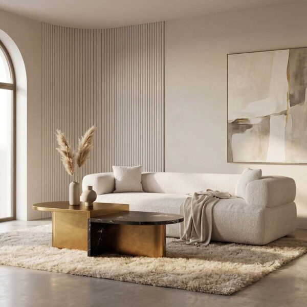 Elegant white curved sofa with gold and marble coffee tables in a contemporary luxury home interior in Dubai and Abu Dhabi, UAE.