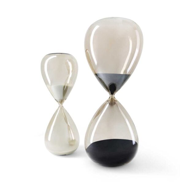 Set of luxury glass hourglasses in warm sand and dark tones, Dusk and Dune collection décor pieces for contemporary interiors in Dubai and Abu Dhabi, UAE.