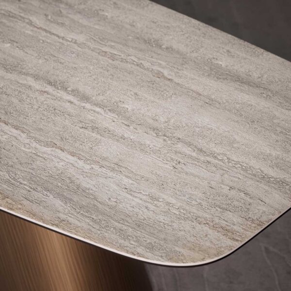 Close-up of Knotta Dining Table ceramic top with natural travertine finish, showcasing smooth texture and refined craftsmanship — luxury furniture in Dubai and Abu Dhabi.
