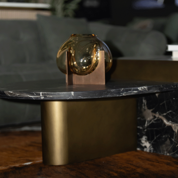 Luxury contemporary coffee table crafted from natural marble and elegant metal, paired with a modern designer sofa, created for premium living spaces in Dubai and Abu Dhabi, showcasing sophisticated materials and high-end interior styling