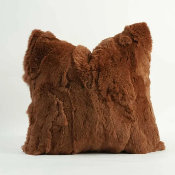 Luxury velvet cushion in warm caramel brown, finished with soft fur edges. Calvora Cushion by Conceptual Furniture Dubai – elegant home décor accent for modern interiors in UAE and Abu Dhabi.