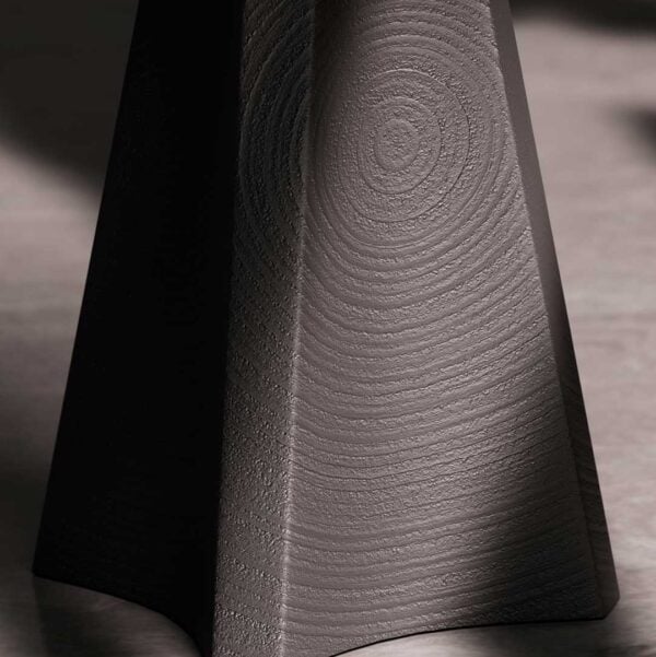 Close-up of Lenora Alto black oak side table base highlighting sculptural wood texture — modern craftsmanship and luxury finish in Dubai, UAE.