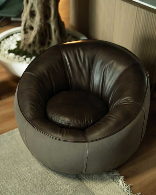 Full view of Opulent Lounge Chair in interior setting — soft grey velvet and polished metal base in Dubai luxury home.