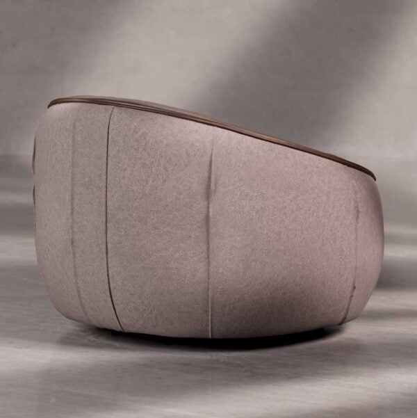 Back view of Opulent Lounge Chair showcasing soft grey fabric and rounded structure — modern minimalist design Dubai.