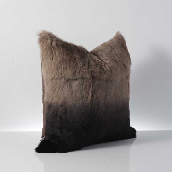 Side angle of Velmira rabbit hair cushion showing smooth gradient from brown to black, perfect for luxury living rooms in Abu Dhabi.