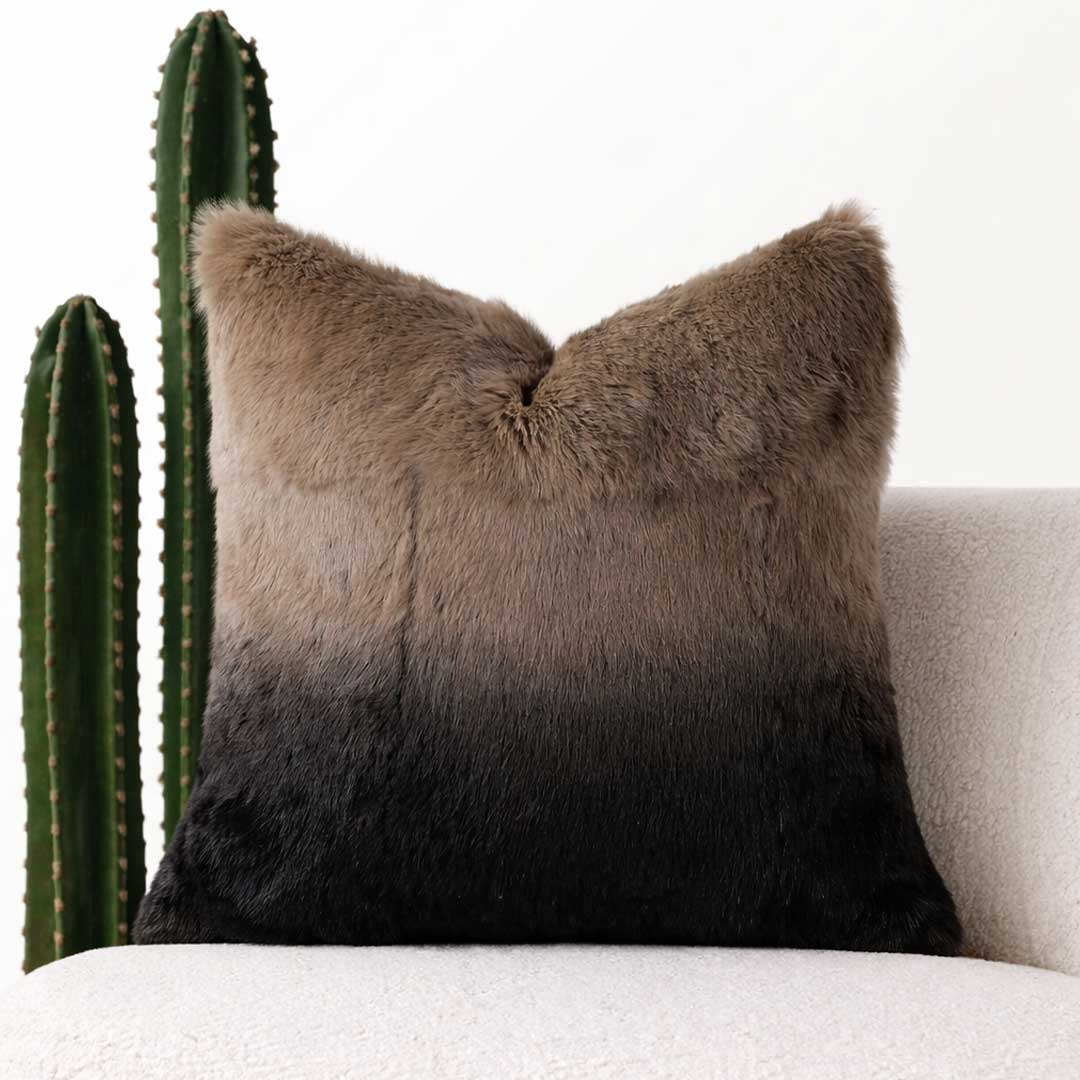 Velmira cushion in soft rabbit hair with coffee-to-black gradient finish, a premium home accessory for Dubai and Abu Dhabi homes.