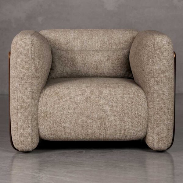 Front view of Cove sculptural lounge chair with thick rounded arms, deep seat cushion, and architectural form in premium woven fabric, ideal for luxury villas and developer projects in Dubai and Abu Dhabi UAE.
