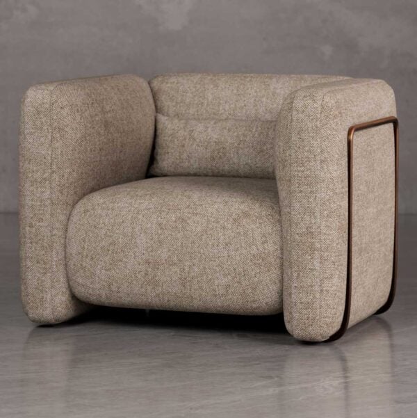 Luxury Cove lounge chair with bold rounded armrests and architectural box form in textured upholstery, a premium American designer chair for luxury real estate and developer interiors in Dubai and Abu Dhabi UAE.
